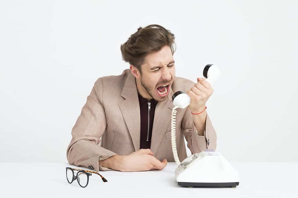 Man Yelling into Phone