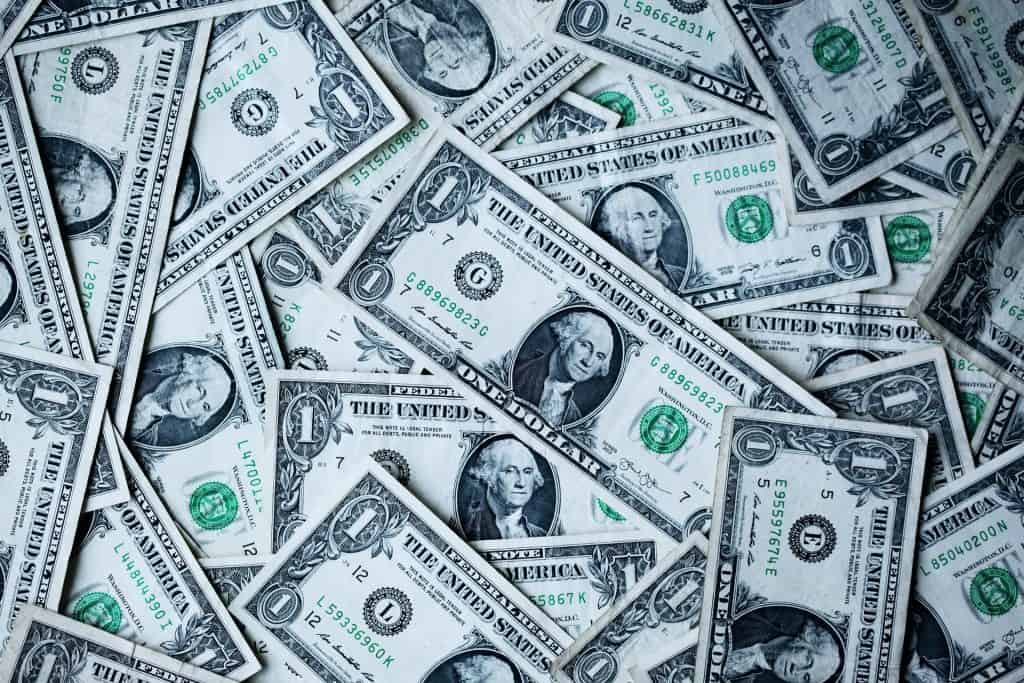 Table Filled With Dollar Bills