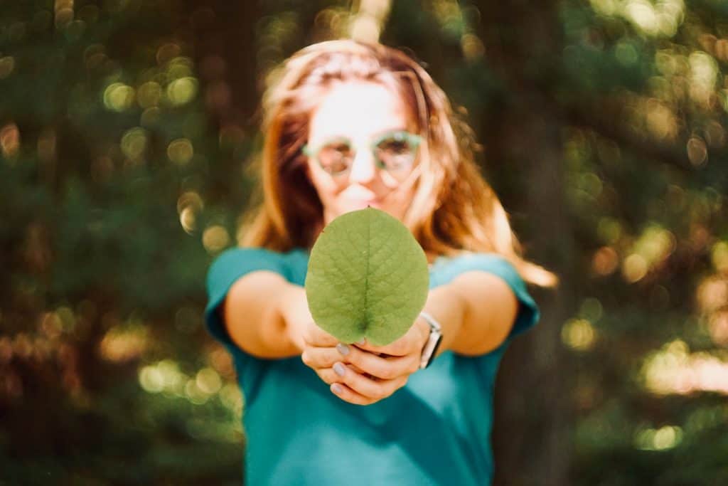 Woman Holding a Leaf