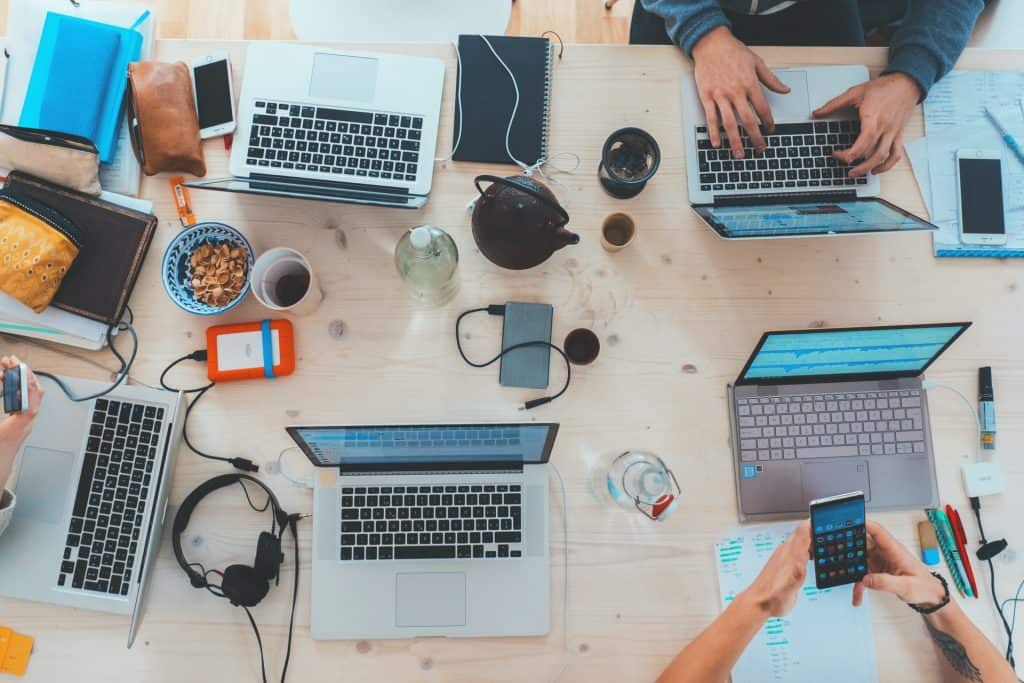 Messy Table with Laptops