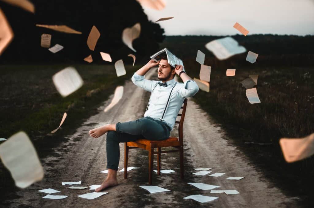 Test Person with Books and Papers Everywhere
