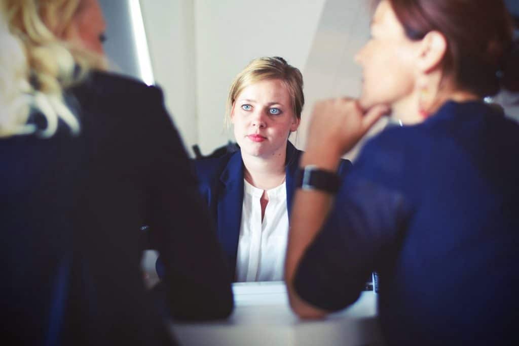 Three Professionals Thinking Talking