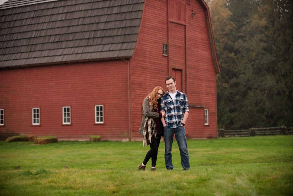 Couple in Front of Barn Home Barndominium