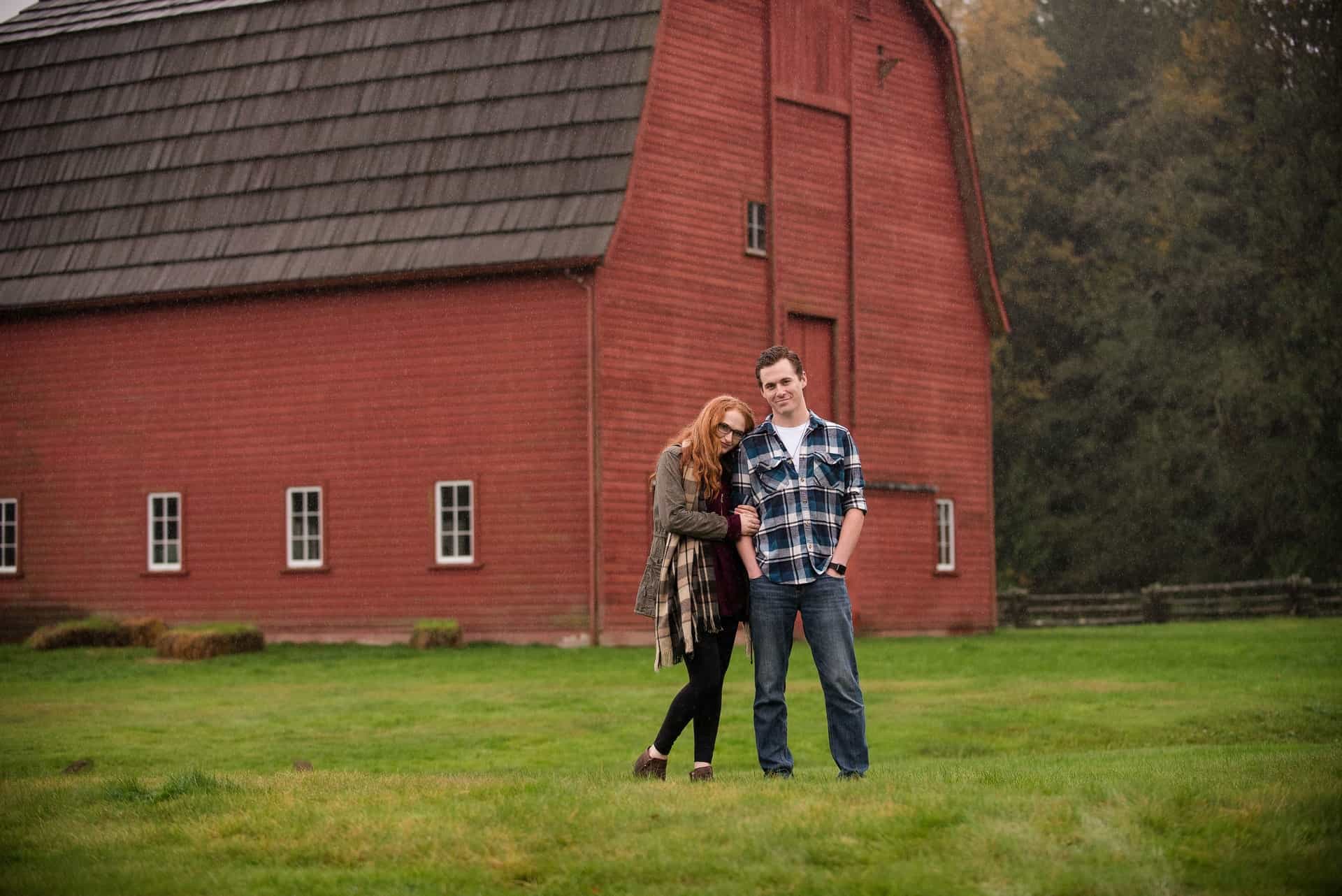 Couple in Front of Barn Home Barndominium Couple in Front of Barn Home Barndominium