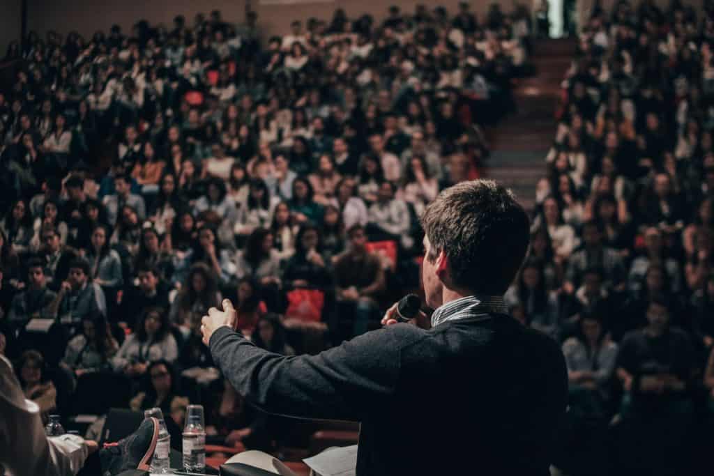 Person Speaking to a Crowd