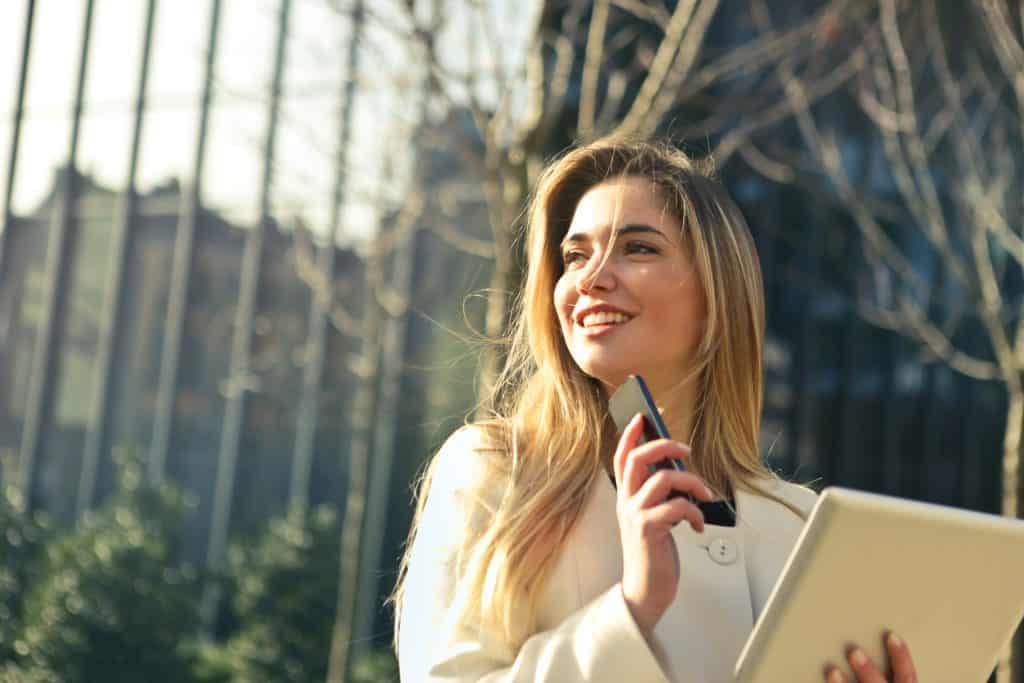 woman smile papers work