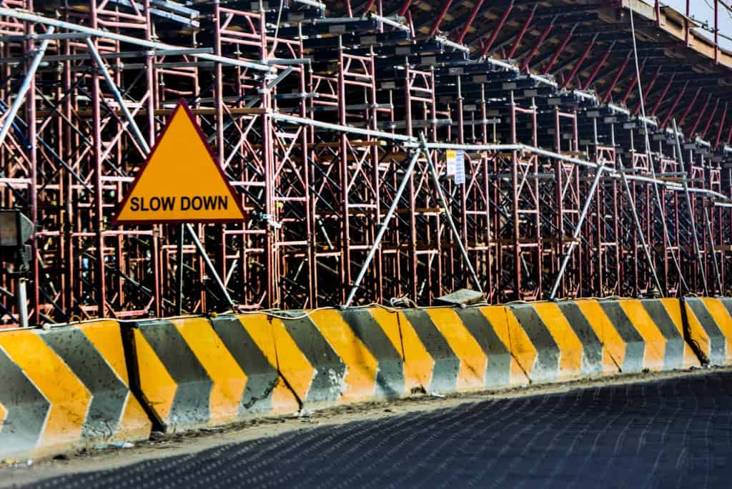 slow down construction sign