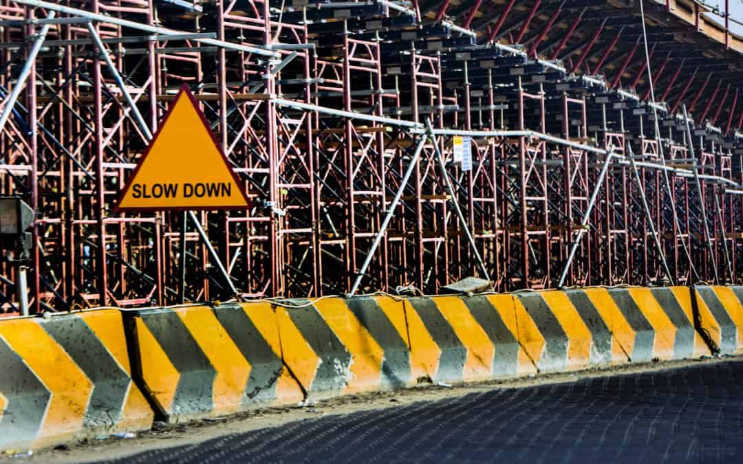 slow down construction sign