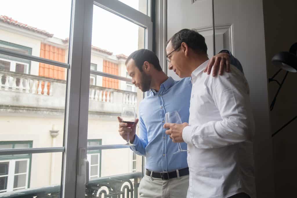 two guys looking out window