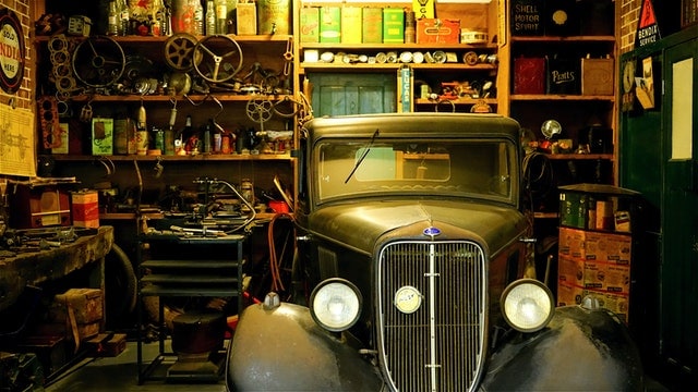 Vintage Ford truck in cluttered garage representing mental hobby shop