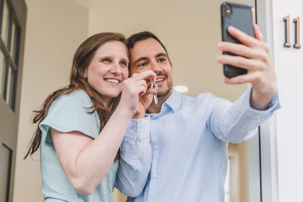 happy couple buying house