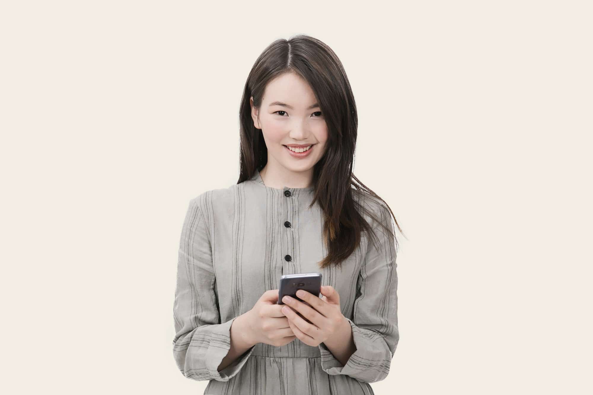 Smiling woman holding phone