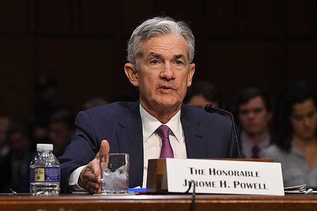 Powell Backpedals on Rate Cuts, Citing Stubborn Inflation