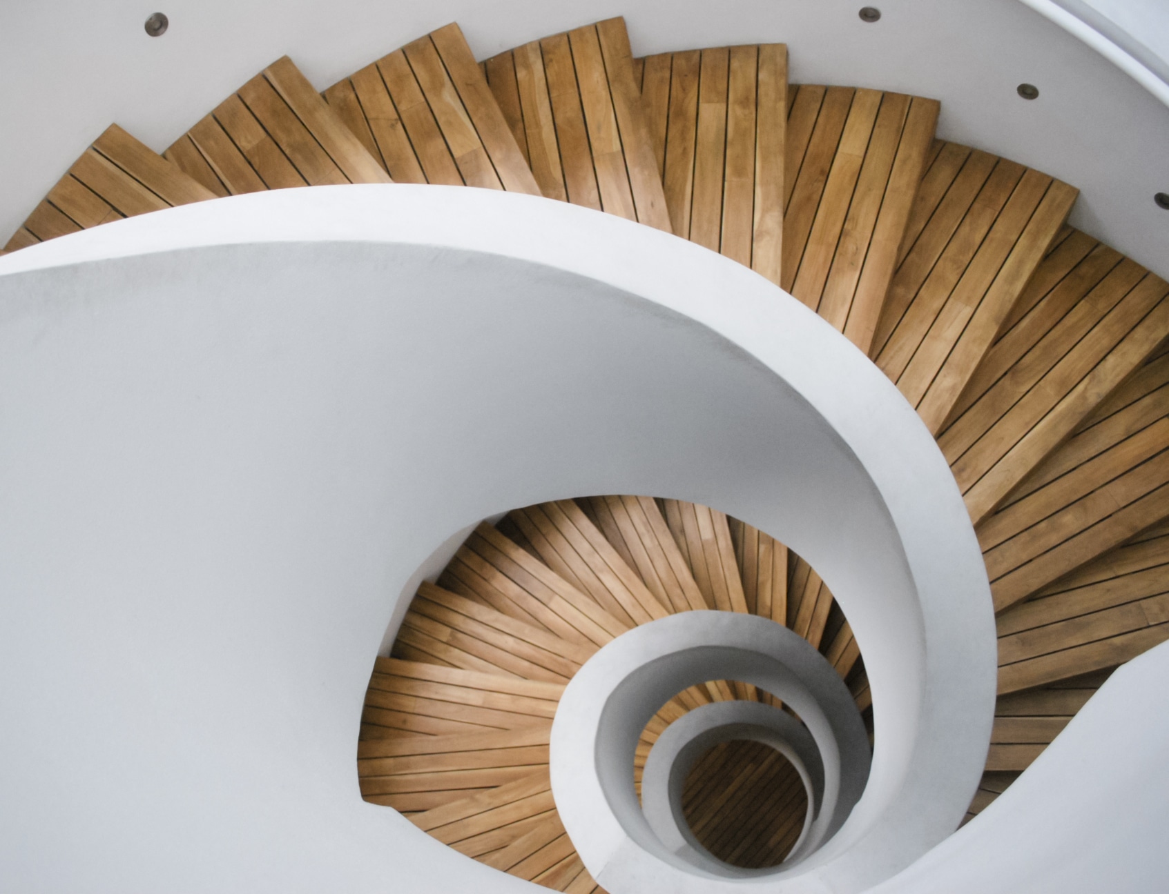 Modern spiral staircase with wooden planks