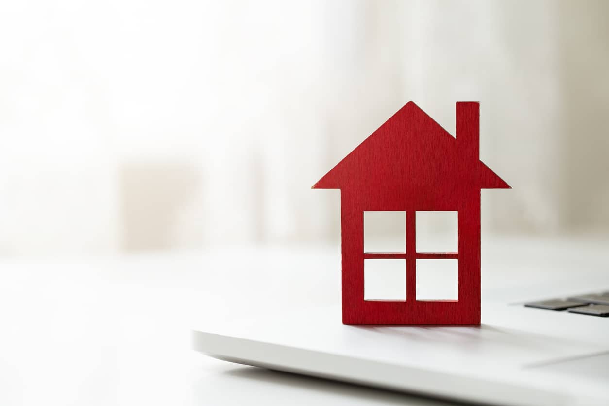 Mortgage Concept, House Icon on Laptop Keyboard