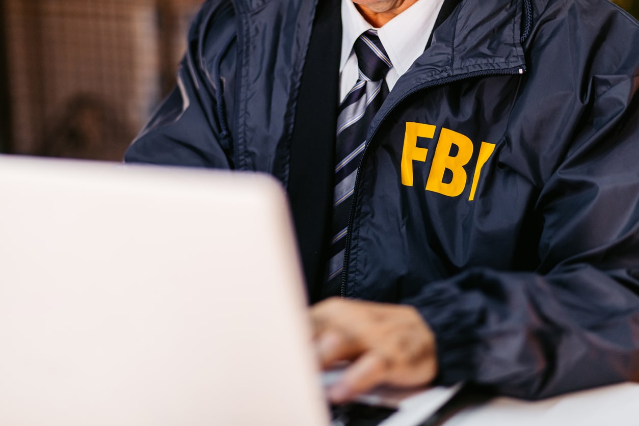 FBI Detective Using Laptop In His Office