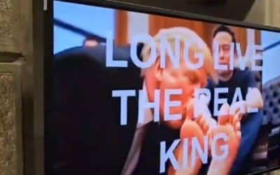 AI-Produced Video of Trump Kissing Musk’s Feet Broadcast at HUD HQ