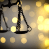 Scales of justice symbolizing legal consequences in a real estate escrow fraud case