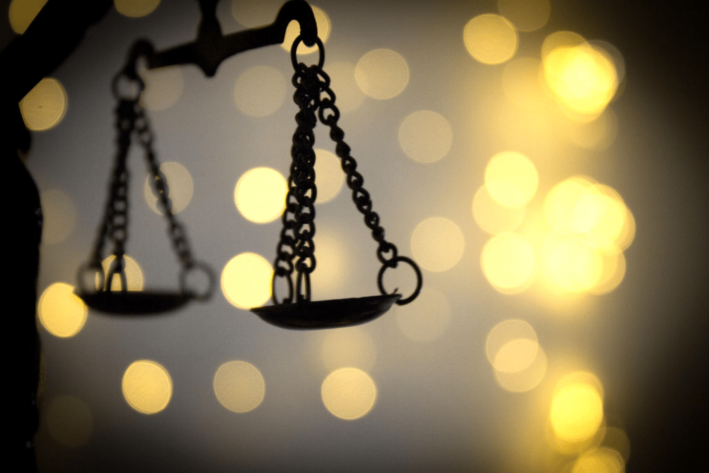 Scales of justice symbolizing legal consequences in a real estate escrow fraud case
