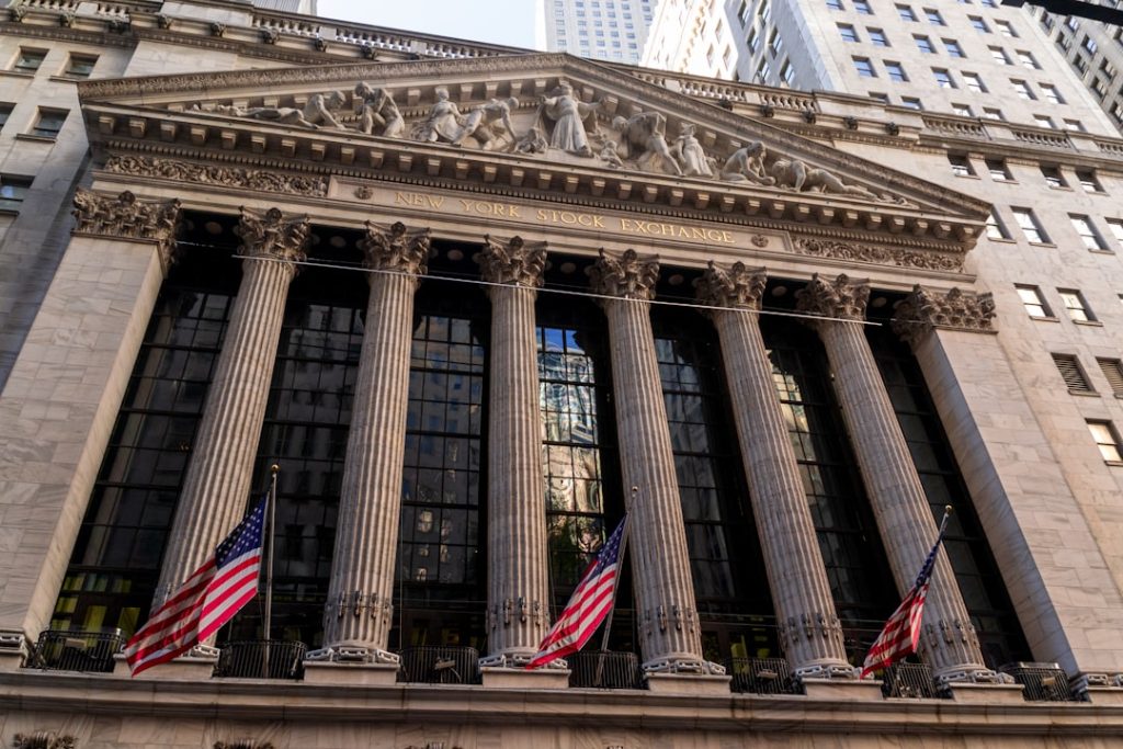 New York Stock Exchange with American flags as the 10-year Treasury yield rises above 5.05%