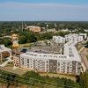 Modern apartment buildings viewed from above, illustrating the multifamily properties financed through agency lending programs.