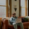Professional using a laptop, illustrating integrated banking and property-management operations in the AppFolio-Column partnership