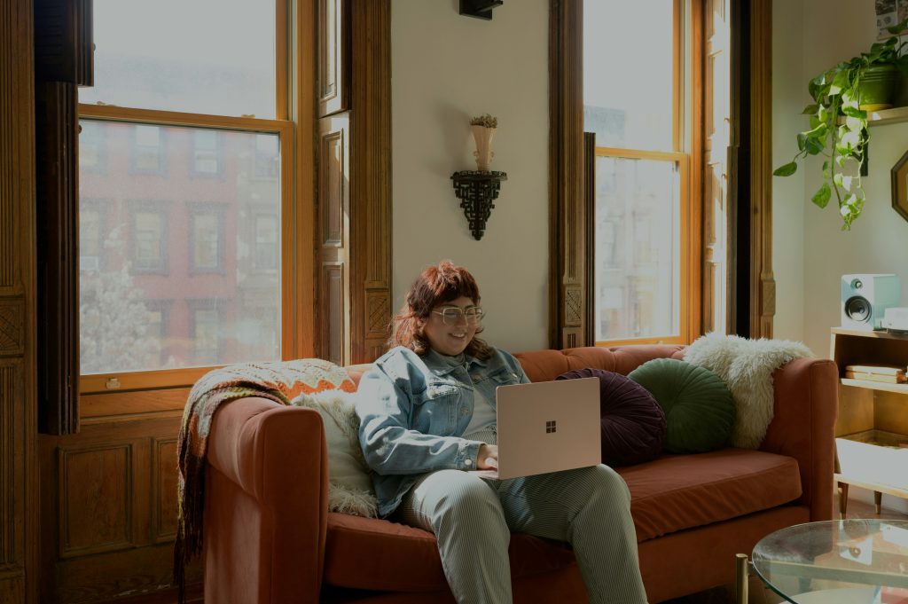 Professional using a laptop, illustrating integrated banking and property-management operations in the AppFolio-Column partnership