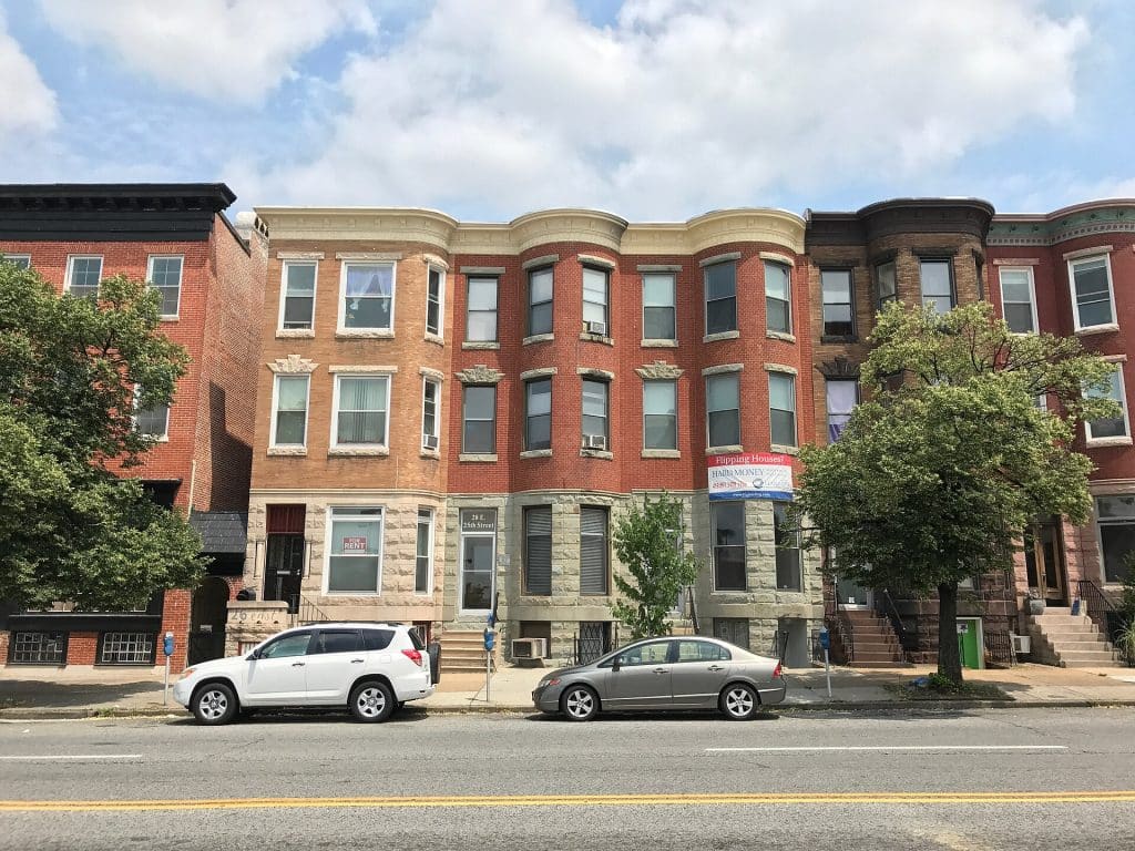 Baltimore rowhouses illustrating the investment-property market at issue in Ameritrust Mortgage's federal DSCR fraud allegations