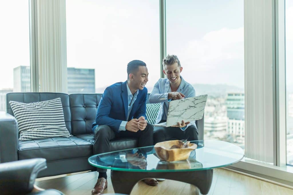 Business team working together, illustrative image for mortgage team move. Photo by Austin Distel/Unsplash.