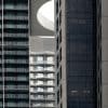 Modern high-rise residential buildings with balconies, illustrating condominium projects subject to mortgage project eligibility rules.