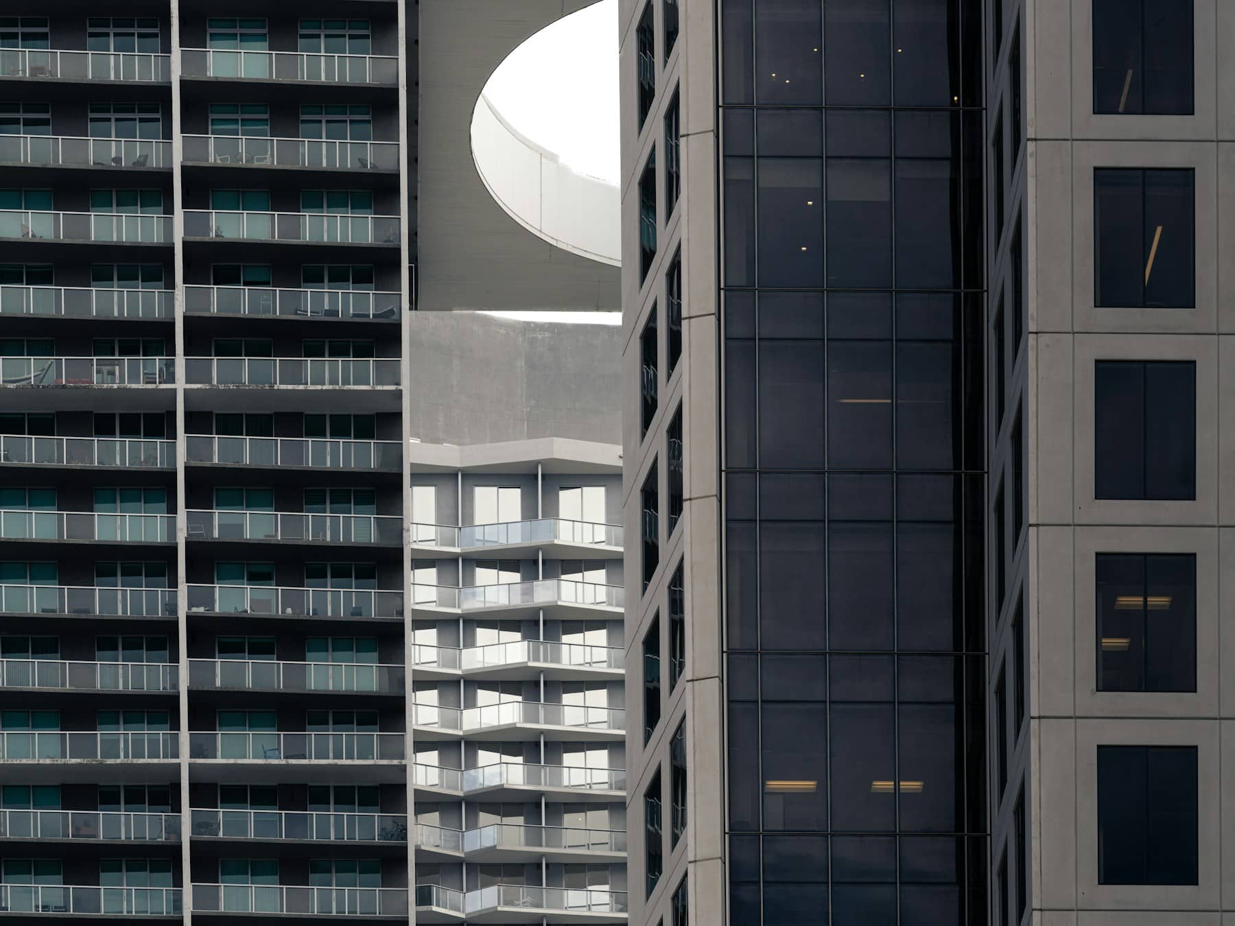 Condominium Financing — UWM Expanded Eligibility Modern high-rise residential buildings with balconies, illustrating condominium projects subject to mortgage project eligibility rules.