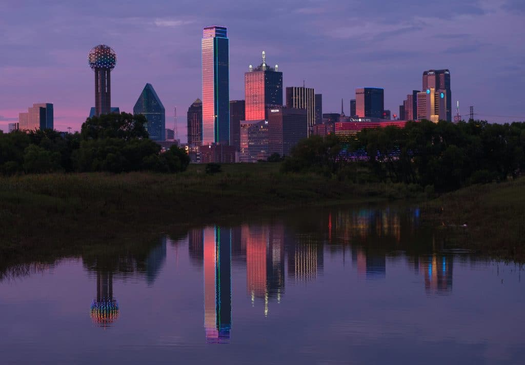 Downtown Dallas skyline at sunset viewed across the Trinity River