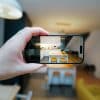 Smartphone camera framing a residential interior for a real estate listing