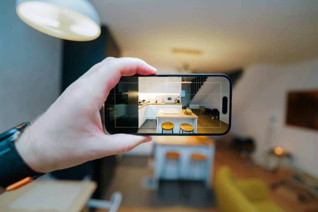Smartphone camera framing a residential interior for a real estate listing