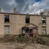 Weathered residential property in distressed condition