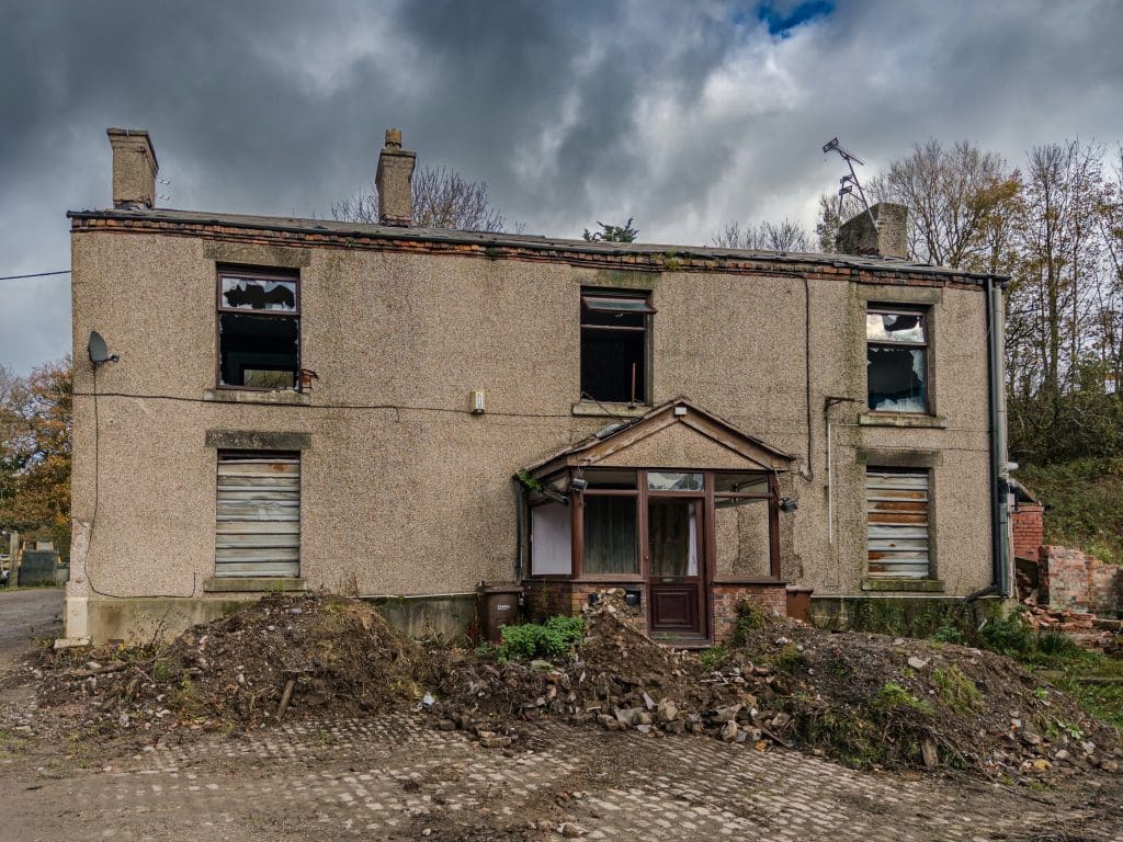 Weathered residential property in distressed condition