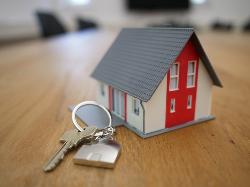 House model and keys representing Fannie Mae mortgage loan sale