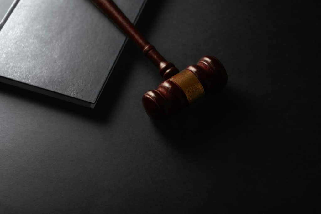 Judge's gavel and law book representing a federal appeals court ruling involving NAR membership rules