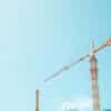 Construction crane at a development site, used as an illustrative image for the Lyra Palmetto Bay apartment financing story