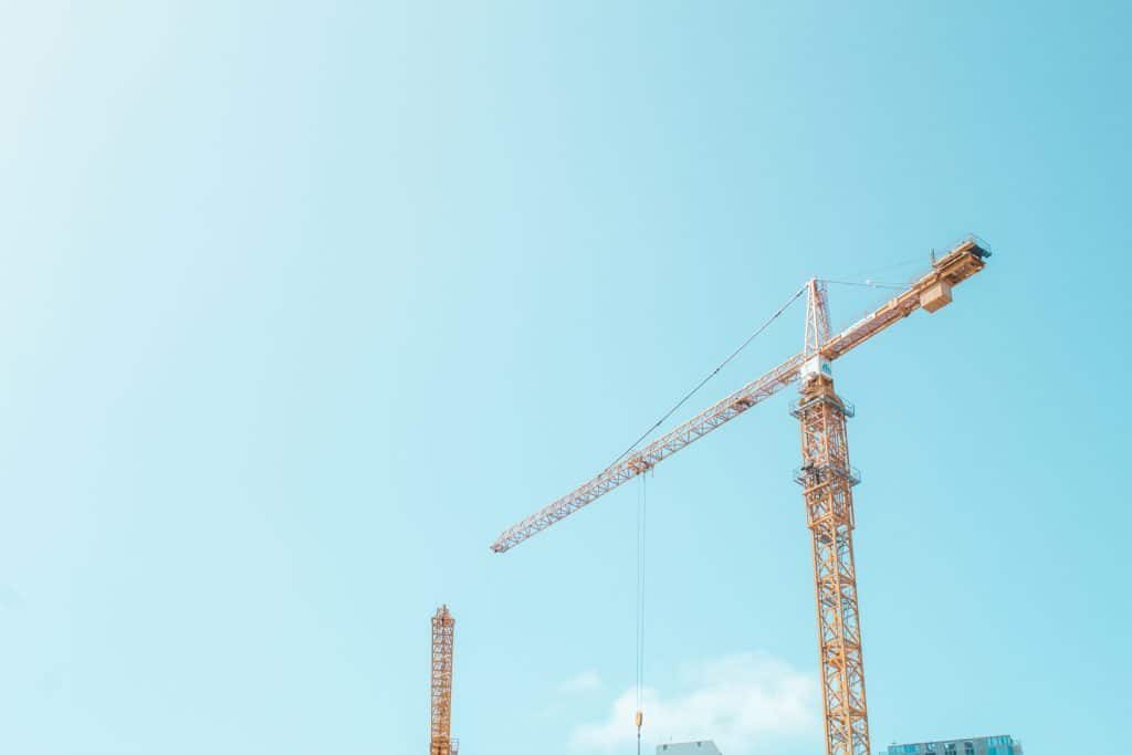 Construction crane at a development site, used as an illustrative image for the Lyra Palmetto Bay apartment financing story