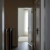 Open doorway into a bright residential interior illustrating homes available to buyers as pending sales slow.