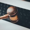 Gavel resting on a computer keyboard illustrating HouseCanary's Chapter 11 bankruptcy and technology litigation