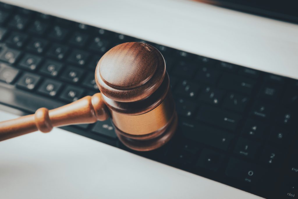 Gavel resting on a computer keyboard illustrating HouseCanary's Chapter 11 bankruptcy and technology litigation