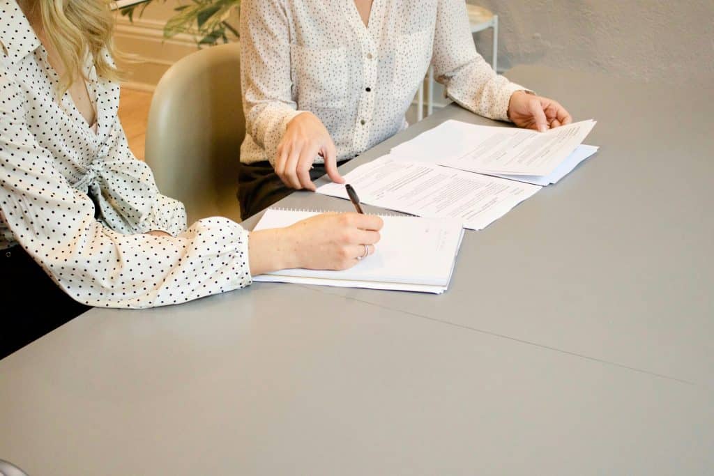 Mortgage professionals reviewing loan documents