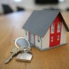 House model and keys illustrating mortgage rates and home financing