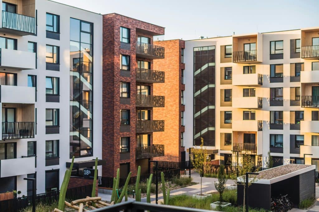 Apartment buildings illustrating the Independence Realty Trust and Centerspace transaction