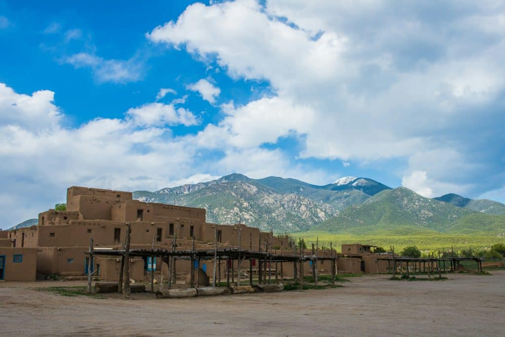 Adobe building with mountains in New Mexico