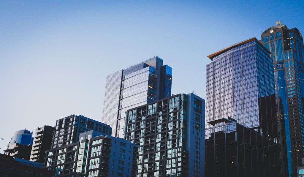 Commercial office buildings illustrating Northmarq's acquisition of Thirdline Capital Management