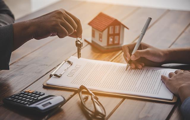 Pending Home Sales August 2026 Home purchase contract being signed with house keys and model home