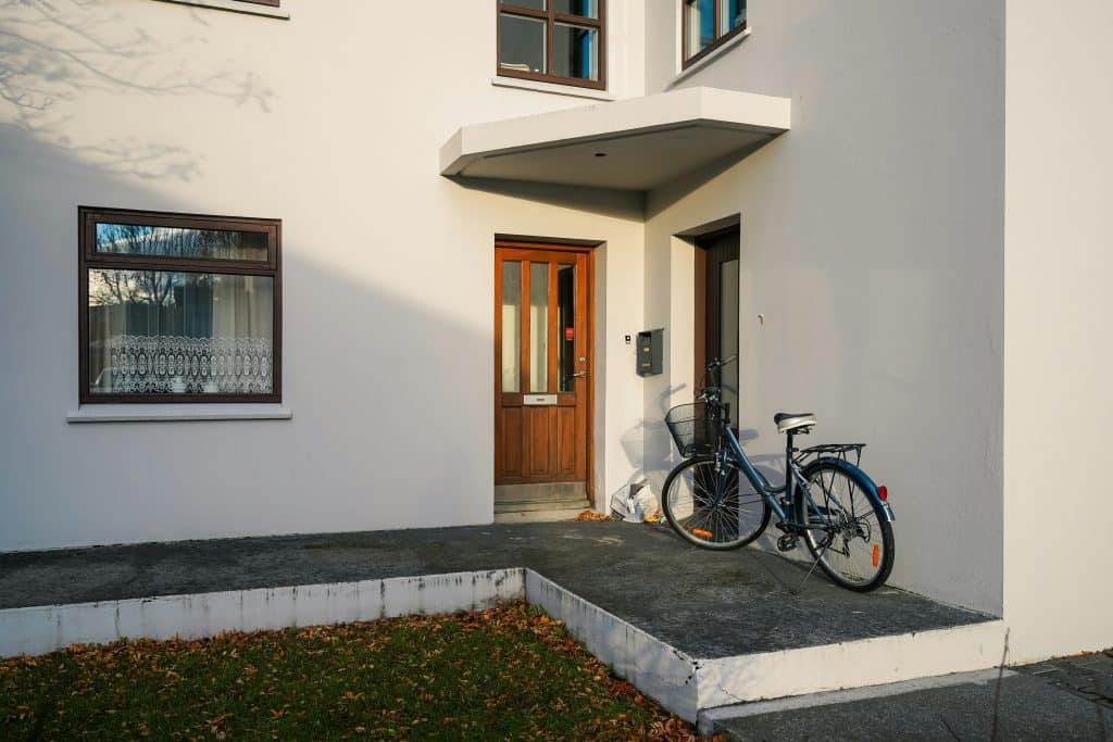 Residential property entrance illustrating the field-safety risks real estate agents face during showings and open houses